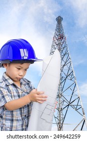 Dream Of The Child's Future Career, Little Asian (thai) Boy With Blue Helmet And Blueprint, Telecommunications Tower In A Day Of Clear Blue Sky