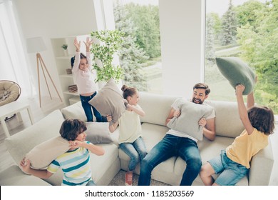 Dream, Dreamy Leisure Lifestyle Crazy Careless Dad Concept. Portrait Of Stylish Family With One Parent And Four Kids Spend Free Time At Light Bright Living Room On Comfort Sofa Play At Different Games