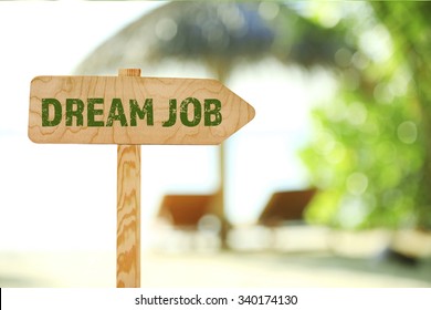 Dream job concept. Wooden sign board on nature background