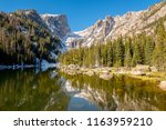 Dream Lake and reflection with mountains in snow around at autumn. Rocky Mountain National Park in Colorado, USA. 