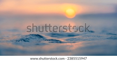 Dream meditation sunset closeup waves ripples with endless horizon. Romantic heavenly sunlight orange blue colors on sea water surface. Beautiful inspirational nature background. Panoramic art view