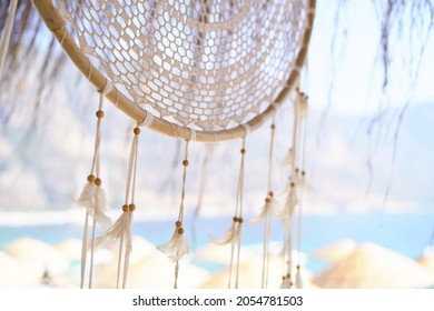 Dreamcatcher on the background of the sea on a turkish sandy beach