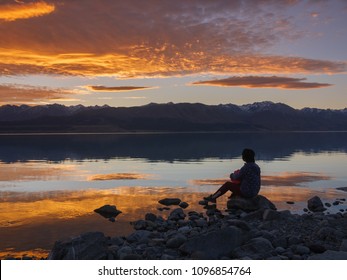 Dreamer, Silhouette Of Woman Sitting Along The Lake At Sunset, Human Strength, Psychology Concept