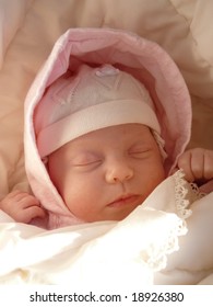 Dreaming Sweet Baby Girl In Knitted Bonnet And Pink Hood Wrapped Soft Blanket