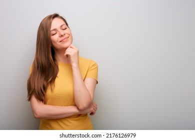 Dreaming Thinking Woman With Eyes Closed. Female Portrait In Yellow Shirt.