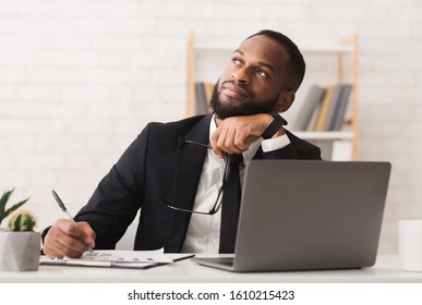 Dreamy Afro Entrepreneur Thinking About His Company Future, Making Plans, Copy Space