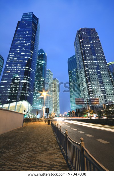 Dreamy blue of modern office buildings at night in\
Far East