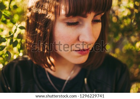 Similar – Hopeful Portrait of a Young Woman at the Window