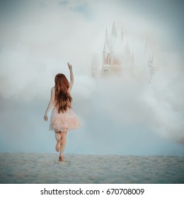 Dreamy fine art picture of a girl chasing a castle in the sky. Imagination concept