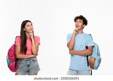 Dreamy high school pupils students teenagers classmates boy girl friends in casual clothes with bags touching chin looking up empty copy space blank isolated over white background. Education concept - Powered by Shutterstock