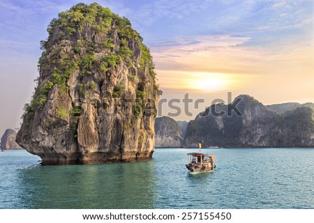 Dreamy sunset among the rocks of Halong Bay, Vietnam