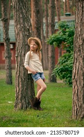 Dreamy Tween Girl Leaning Against Tree In Green Summer Courtyard Of Country House