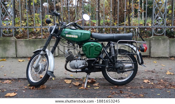 Dresden, Germany, 11-19-2020, an old green moped of the former GDR called Simson, beside the road in Dresden