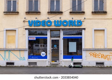 DRESDEN, GERMANY - 28. August 2021: A Closed Video Store Called Video World. An Abandoned Store In An Old Yellow House. Dvd's Renting In Real Life. A Big Blue Logo Over An Empty Store. 