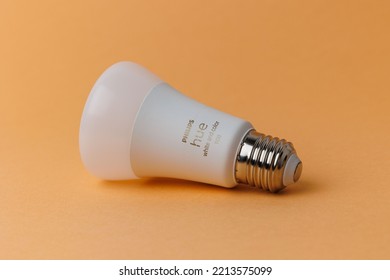 DRESDEN, GERMANY - Aug 01, 2022: The Philips Hue Light Bulb Isolated On Orange Background