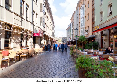 Dresden, Germany - October 21, 2018 - Tourists walking on Monzgasse street 