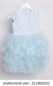 Dress for a girl - festive outfit on a hanger, ball gown for children. High quality photo