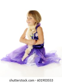 A Dressed Up Elementary Girl Looking Sheepish As She Gets Her Hands Stuck In The Bangles She Wears On Each Arm.  On A White Background.