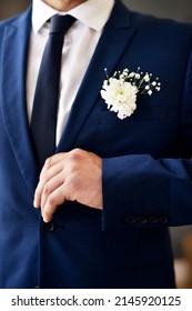 Dressed for the occasion. Shot of an unrecognizable and stylish bridegroom on his wedding day.