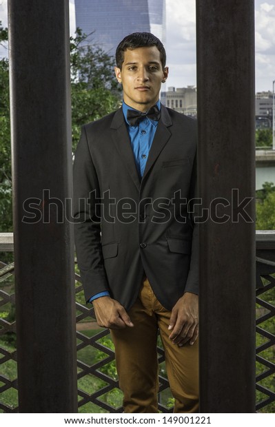 blue shirt and brown pants