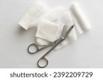 Dressing or clean wound tools includes Roll gauze,pile of gauzes and gauze roll cutter or scissors