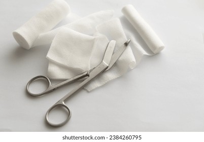 Dressing or clean wound tools includes Roll gauze,pile of gauzes and gauze roll cutter or scissors