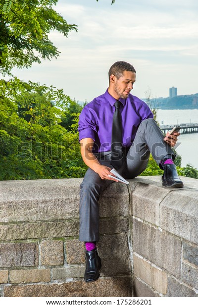 purple shirt and gray pants