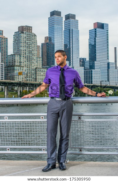 purple shirt and gray pants