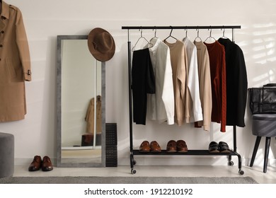 Dressing Room Interior With Clothing Rack And Mirror