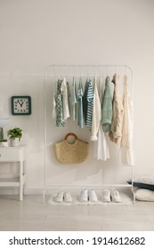 Dressing Room Interior With Clothing Rack And Nightstand