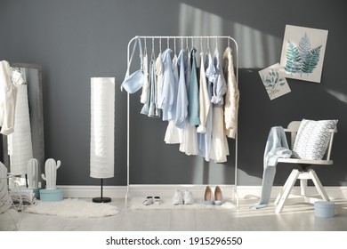 Dressing Room Interior With Clothing Rack And Mirror