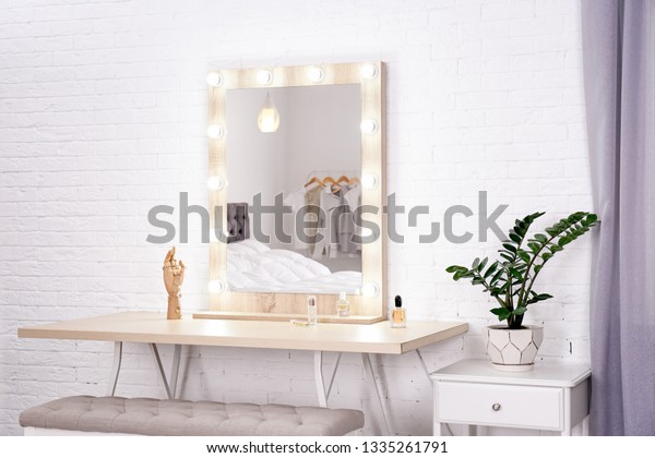 Dressing room\
interior with makeup mirror and\
table