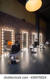 Dressing room with places for hairdresser and make-up artist work - seats and mirror with illumination