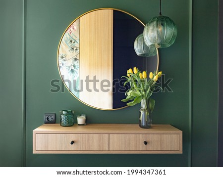 Dressing table with elegant round mirror. Interior design and home staging