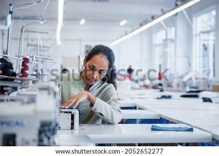 Similar – Image, Stock Photo Young woman crafting with paper at a creative workspace