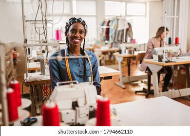 Dressmaker woman working with sewing machine - Powered by Shutterstock