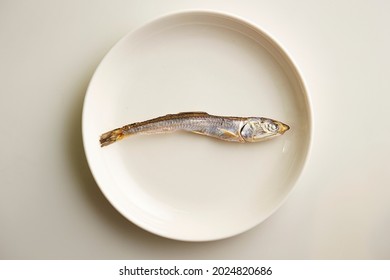 Dried Anchovies On A Small Plate 