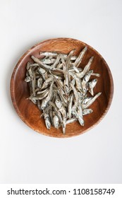 Dried Anchovies On Wooden Plate