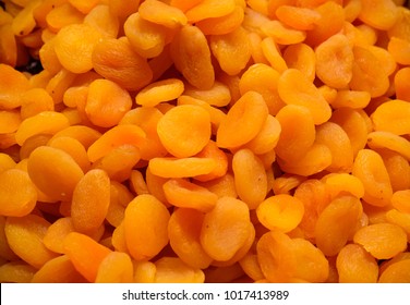 Dried apricots background, tropical fruits preservation in markets for gift and souvenirs