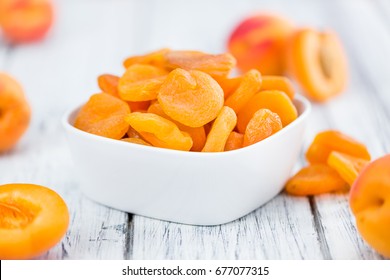 Dried Apricots on a vintage background as detailed close-up shot (selective focus)