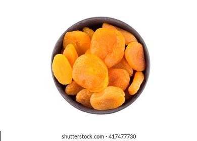 Dried apricots on white background with a light shadow