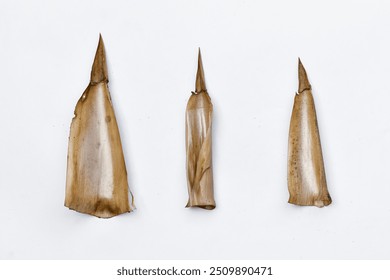 Dried bamboo stem leaves, dry leaves isolated on white - Powered by Shutterstock