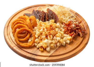 Dried Beef, Fried Pig Ears, Onion Rings, Calamari, Crackers, On A Wooden Board.