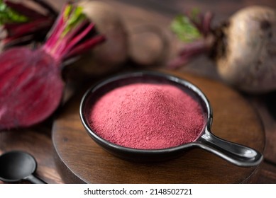 dried beetroot powder in a black bowl, close-up - Powered by Shutterstock