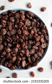 Dried Brown Raisins In A Bowl, Top View. Flat Lay, Overhead, From Above. Close-up.