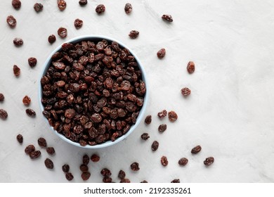 Dried Brown Raisins In A Bowl, Top View. Flat Lay, Overhead, From Above. Space For Text.