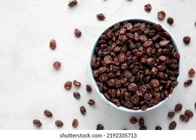 Dried Brown Raisins In A Bowl, Top View. Flat Lay, Overhead, From Above.