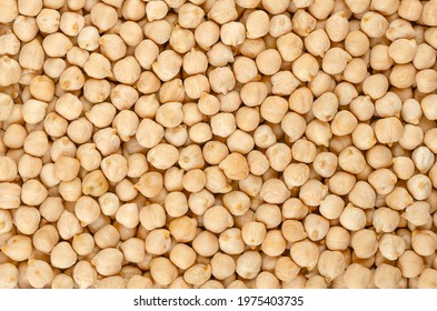 Dried Chickpeas, Background From Above. Whole And Light Tanned Chick Peas, A High In Protein Legume And Fruit Of Cicer Arietinum. Key Ingredient In Hummus And Chana Masala. Backdrop. Macro Food Photo.