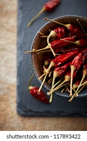 Dried Chili Peppers In A Ceramic Bowl. Natural Foods. Natural Cooking. Natural Spices. Close-up. Copy Space. Flatlay. From Above