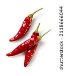 Dried chili peppers placed on a white background. View from directly above.